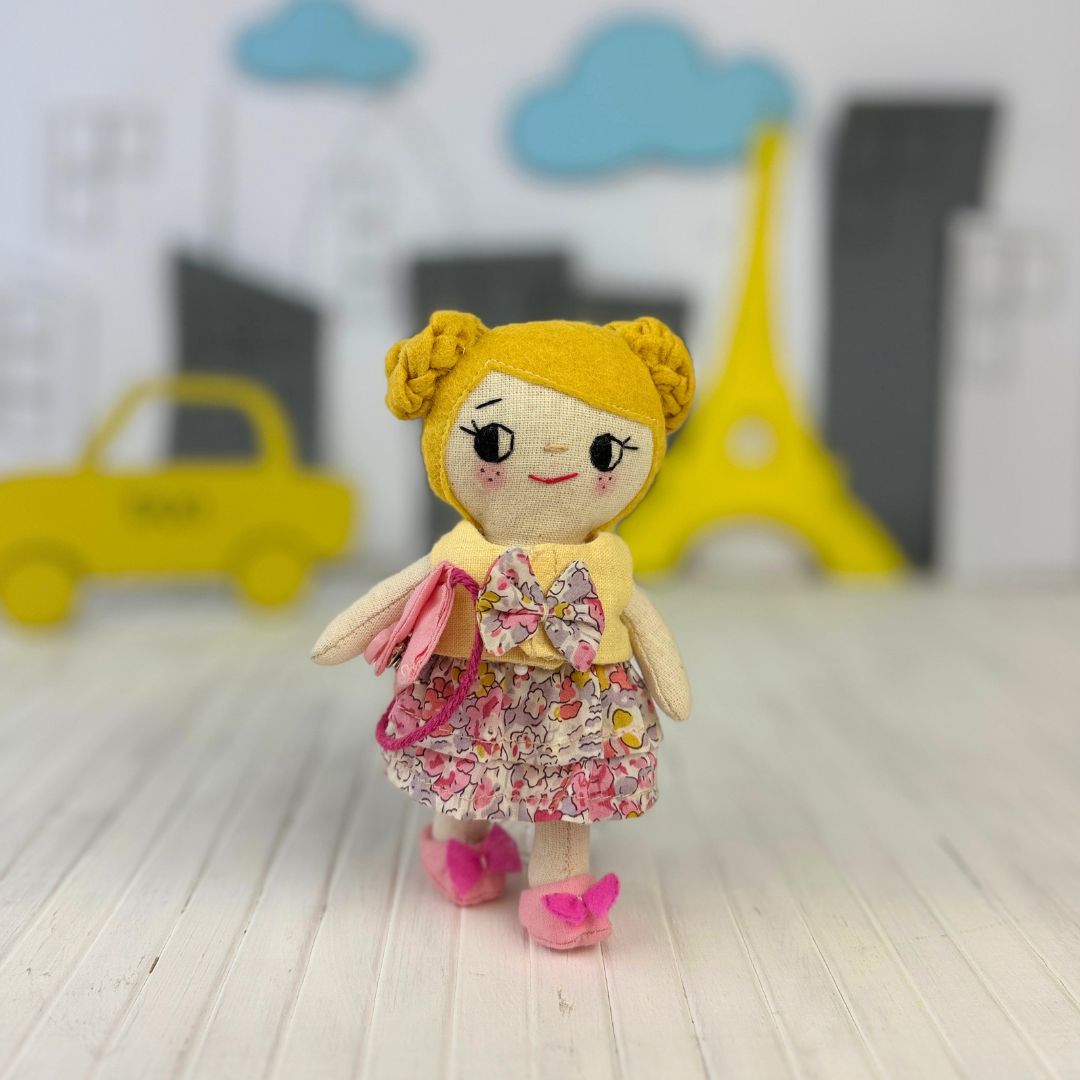 Mini Girl Doll PDF sewing pattern by Stella Pattern Studio featuring the City Stroll Outfit Set with a blouse, two skirt options, mules with bows, and a clutch bag. Beginner-friendly doll sewing tutorial with step-by-step instructions, video support, and free Mini Girl Dolls Coloring Pages.