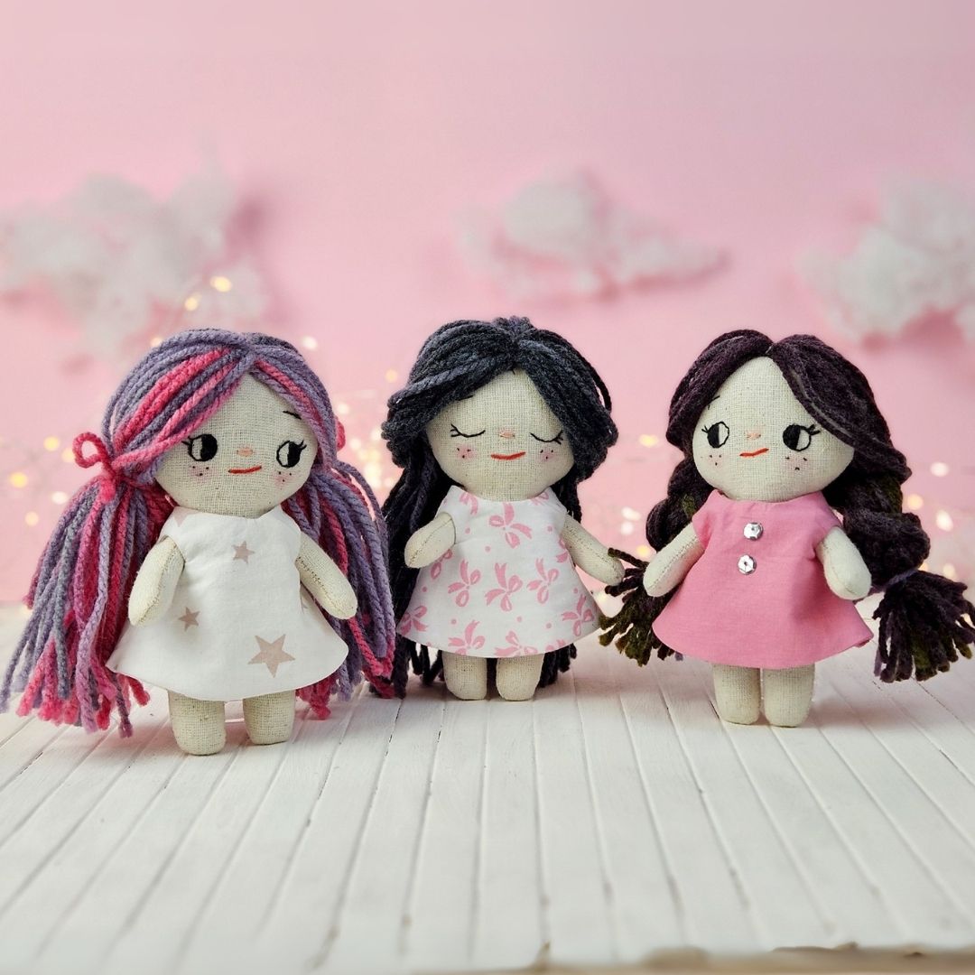 Create your own 5.5” Miniature Fabric Doll with Dress using the easy-to-follow PDF sewing pattern from Stella Pattern Studio. This delightful rag doll is perfect for dollhouses and can wear a variety of outfits, making her ideal for imaginative play.