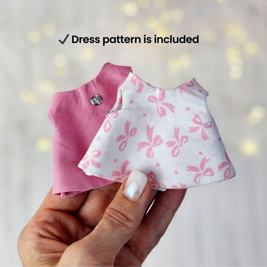 Create your own 5.5” Miniature Fabric Doll with Dress using the easy-to-follow PDF sewing pattern from Stella Pattern Studio. This delightful rag doll is perfect for dollhouses and can wear a variety of outfits, making her ideal for imaginative play.