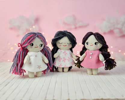 Create your own 5.5” Miniature Fabric Doll with Dress using the easy-to-follow PDF sewing pattern from Stella Pattern Studio. This delightful rag doll is perfect for dollhouses and can wear a variety of outfits, making her ideal for imaginative play.