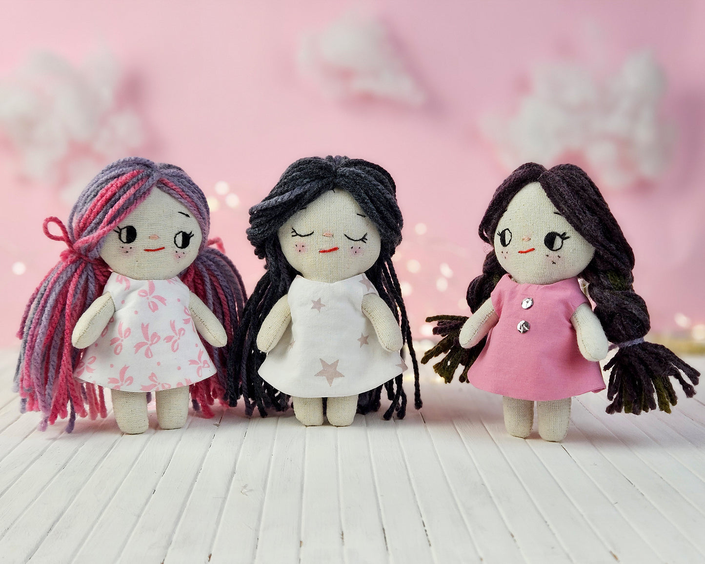 Create your own 5.5” Miniature Fabric Doll with Dress using the easy-to-follow PDF sewing pattern from Stella Pattern Studio. This delightful rag doll is perfect for dollhouses and can wear a variety of outfits, making her ideal for imaginative play.