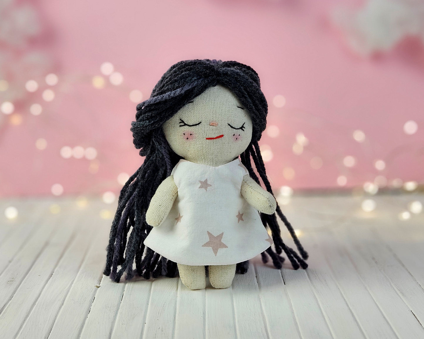 Create your own 5.5” Miniature Fabric Doll with Dress using the easy-to-follow PDF sewing pattern from Stella Pattern Studio. This delightful rag doll is perfect for dollhouses and can wear a variety of outfits, making her ideal for imaginative play.