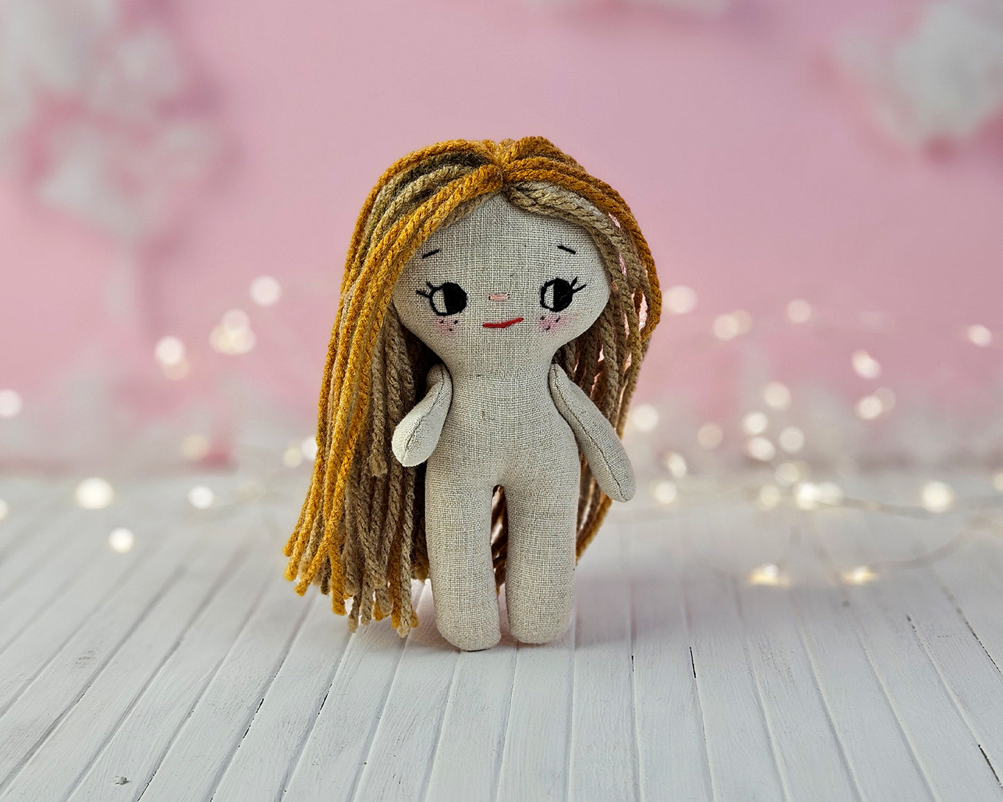 Create your own 5.5” Miniature Fabric Doll with Dress using the easy-to-follow PDF sewing pattern from Stella Pattern Studio. This delightful rag doll is perfect for dollhouses and can wear a variety of outfits, making her ideal for imaginative play.